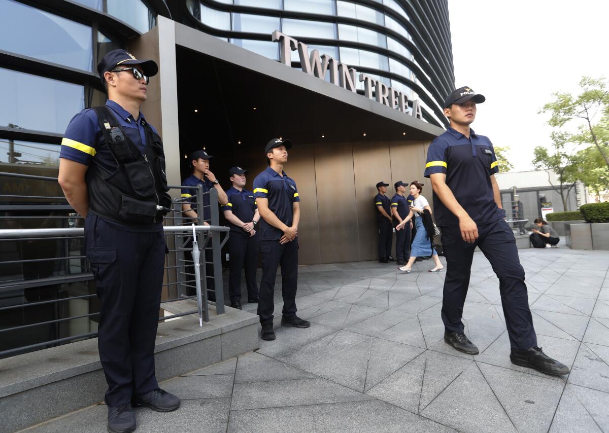 South Korean police officers stand guard against possible rallies opposing Japan in front of the Japanese Embassy in Seoul on Friday.