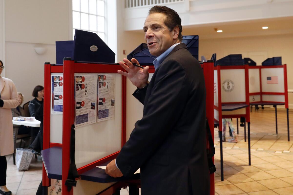 FILE — In this Nov. 6, 2018 file photo, New York Gov. Andrew Cuomo pauses as he marks his ballot, at the Presbyterian Church of Mount Kisco, in Mt. Kisco, N.Y. New York’s attorney general has promised a thorough investigation of allegations that Cuomo sexually harassed at least two women. (AP Photo/Richard Drew, File)