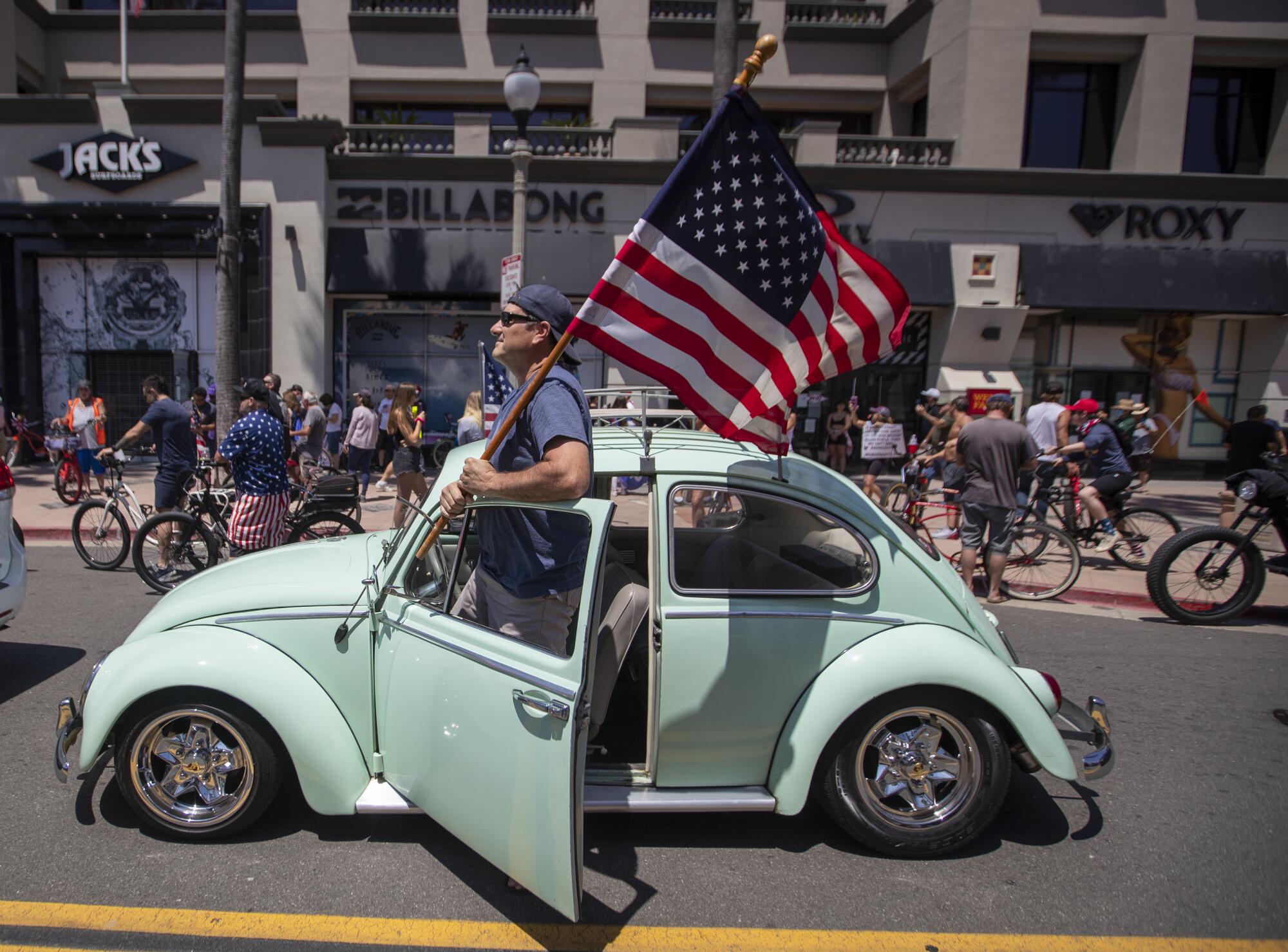 Rally at the intersection of Main Street and Pacific Coast Highway in Huntington Beach 