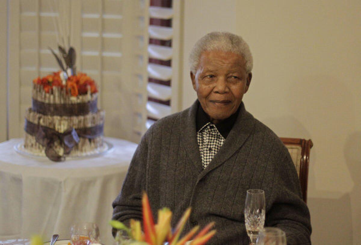 Former President Nelson Mandela is shown celebrating his birthday with family in Qunu, South Africa, on July 18.