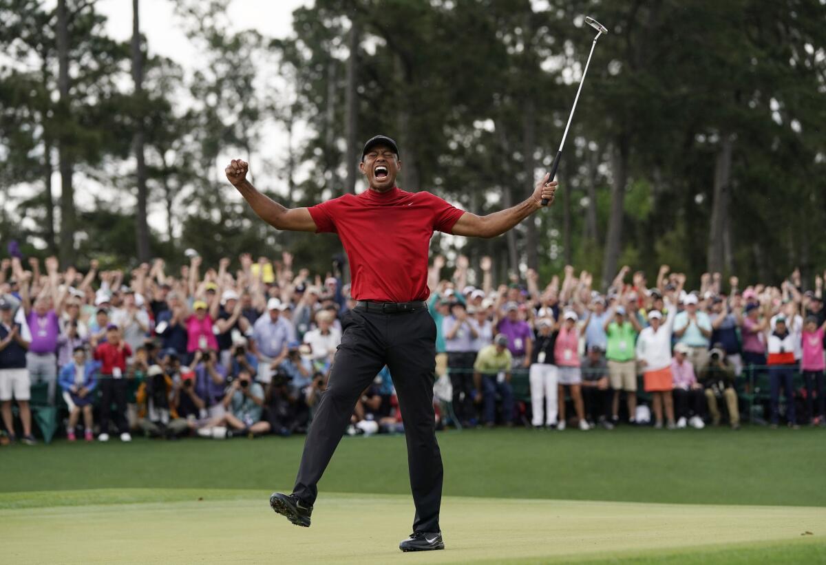 Tiger Woods reacts as he wins the Masters on April 14 at Augusta National.