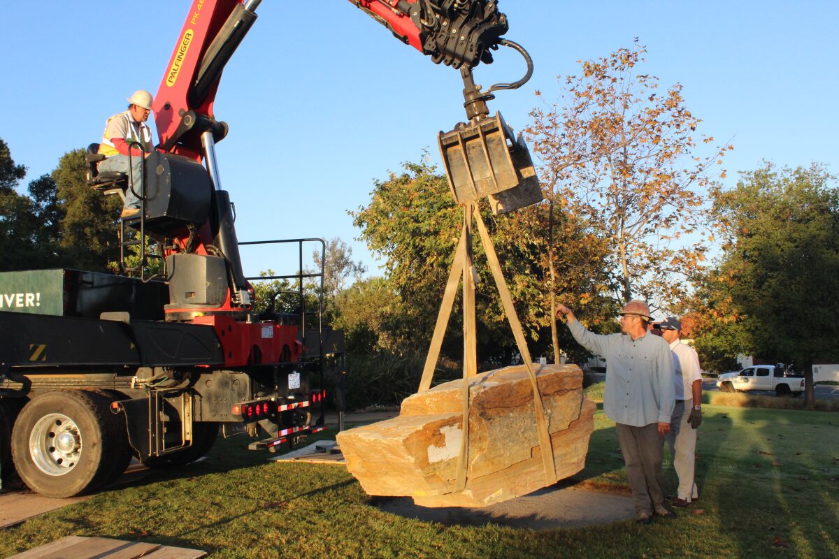 A rock arrives in the Rancho Santa Fe Village park for the new Lilian Rice statue.