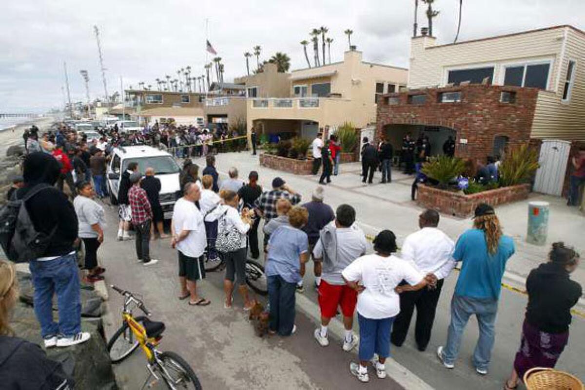 People gather outside the home of Junior Seau on Wednesday.