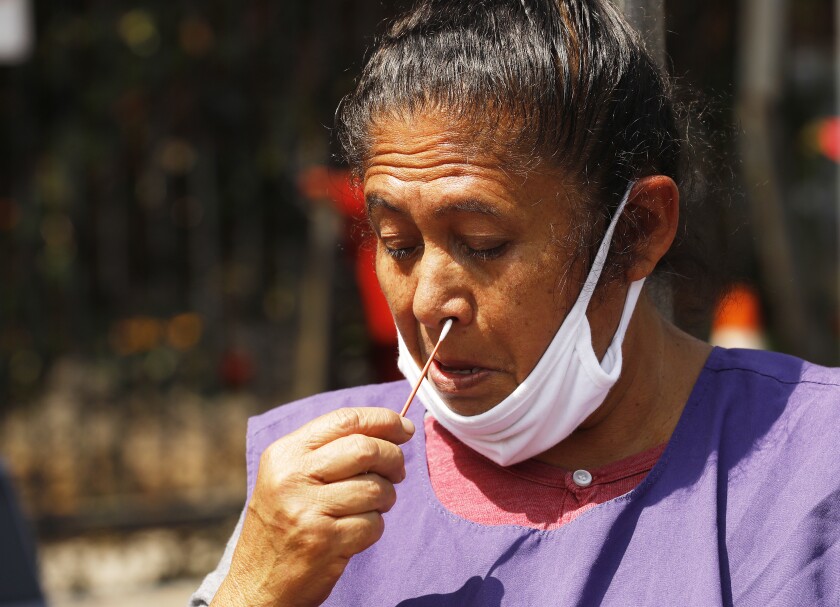 Dolores Velasquez, who volunteers at the Pico Union Project takes the Covid test.