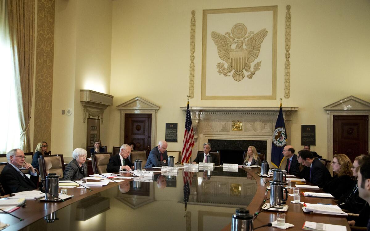 Federal Reserve Chairwoman Janet L. Yellen, second from left, leads a Board of Governors meeting in Washington on Monday.