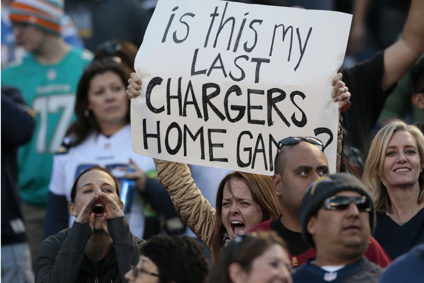 Michelle Gable from Cardiff cheers from her field-level seats Sunday during what could be the Chargers' final game in San Diego.