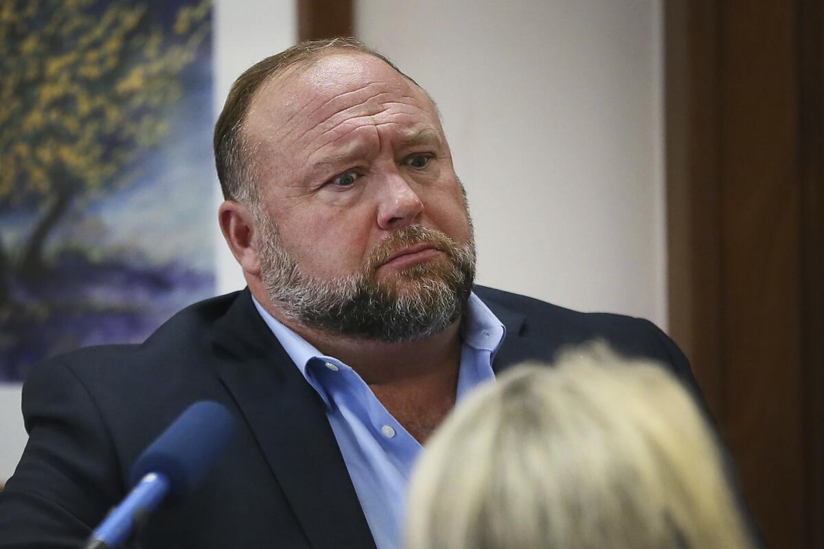 Conspiracy theorist Alex Jones attempts to answer questions during trial in Austin last week. 
