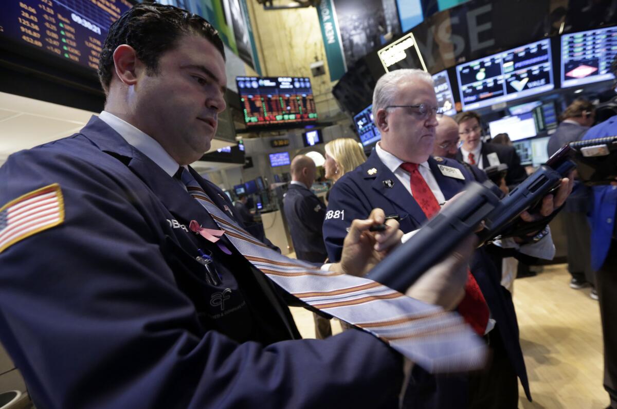 Traders work this week on the floor of the New York Stock Exchange.