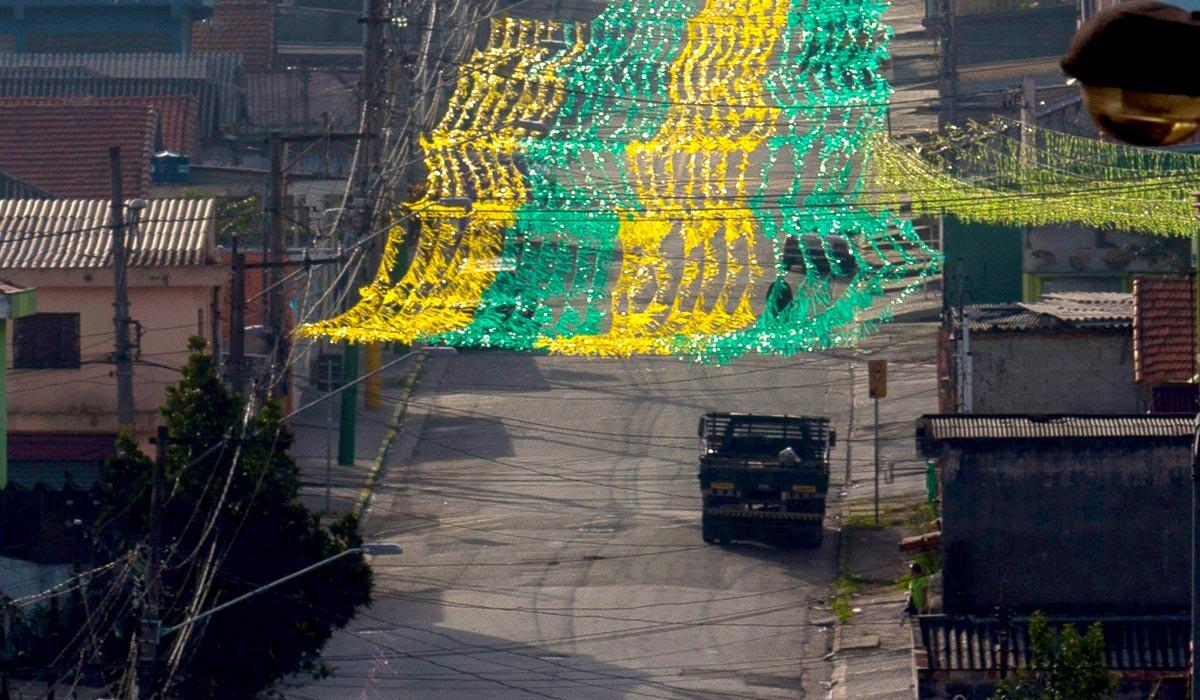 A decorative flag in the colors of the Brazilian team stretches over a street near Corinthians Arena, site of the opening FIFA World Cup game on Thursday.