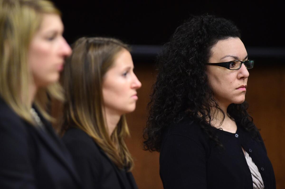 From left, Defense attorneys Kathryn Herold and Jen Beck stand with Dynel Lane as the jury leaves a Boulder District courtroom after announcing a guilty verdict in Lane's trial on Feb. 23, 2016, in Boulder, Colo.