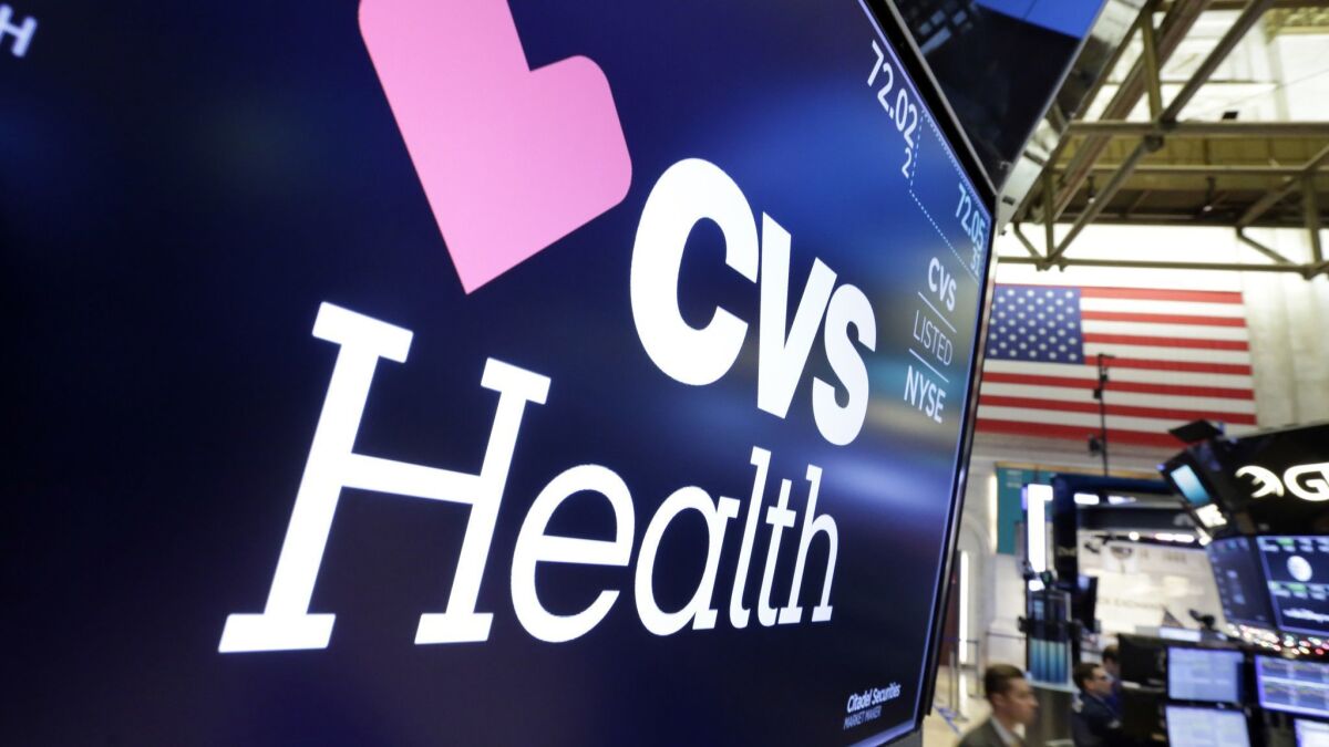 The CVS Health logo on a video display above the floor of the New York Stock Exchange.