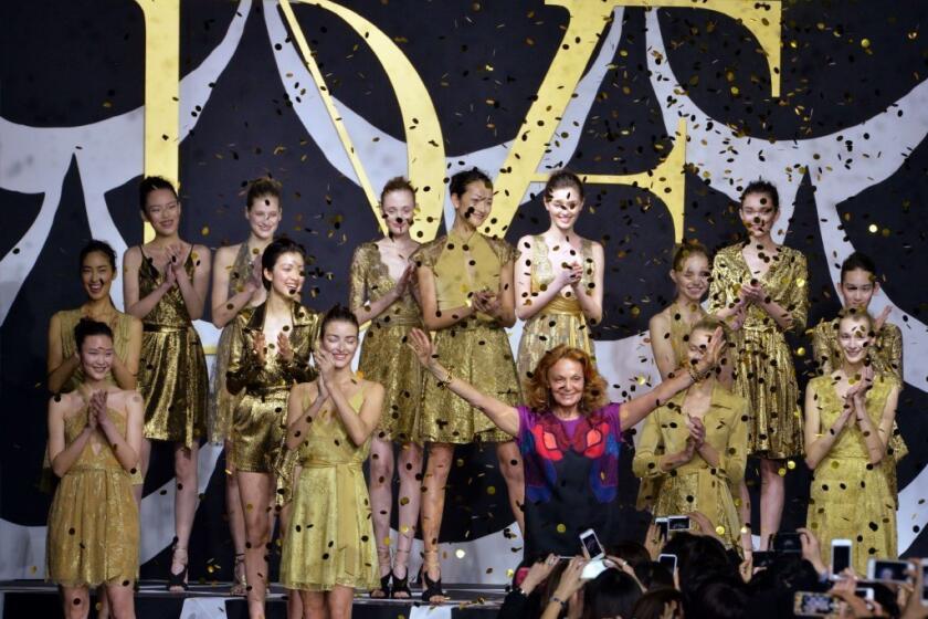 Diane von Furstenberg with models at the runway finale of Tokyo Fashion Week. According to Vanity Fair, the designer has inked a deal with E! for a reality TV series.