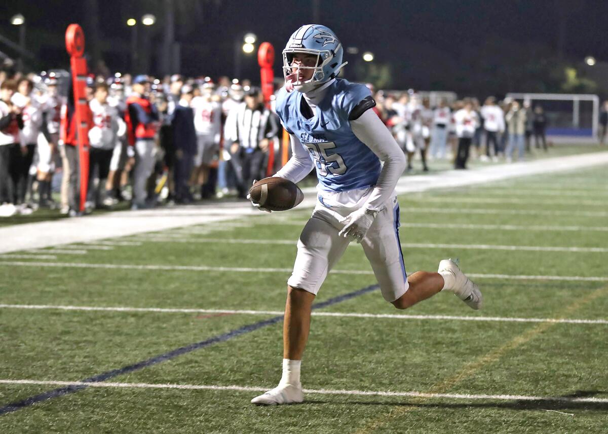 Corona del Mar's Sebastian Boydell (85) jogs into the end zone for a touchdown against Yorba Linda on Friday night.
