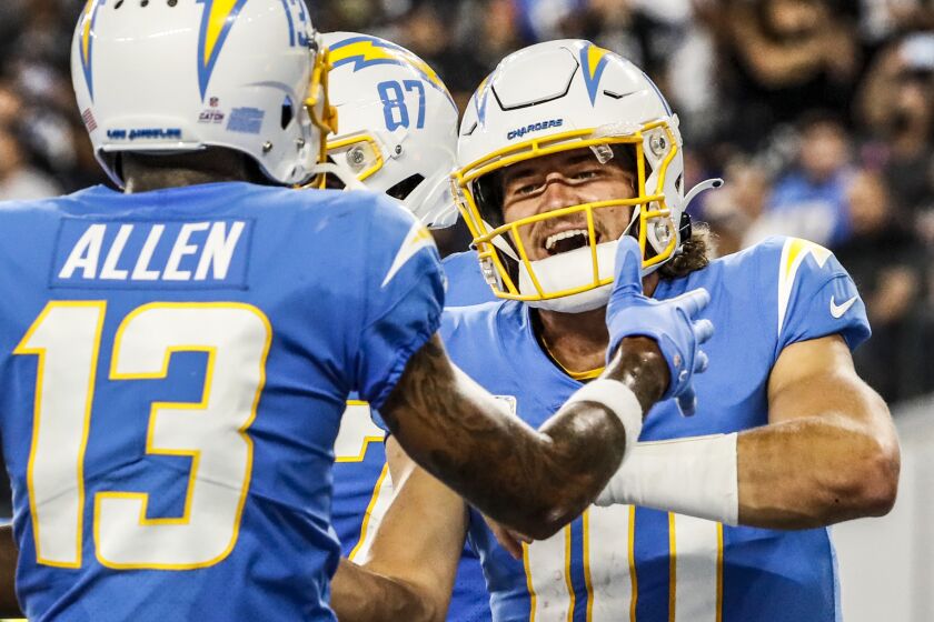 Inglewood CA, Monday, October 4, 2021 - Los Angeles Chargers quarterback Justin Herbert (10) celebrates a touchdown.
