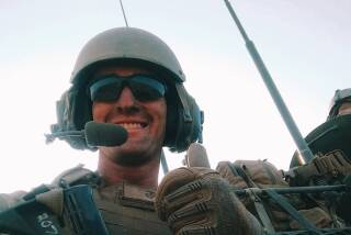 Marine 1st Lt. H. Conor McDowell as troop commander of a Light Armored Vehicle (LAV).