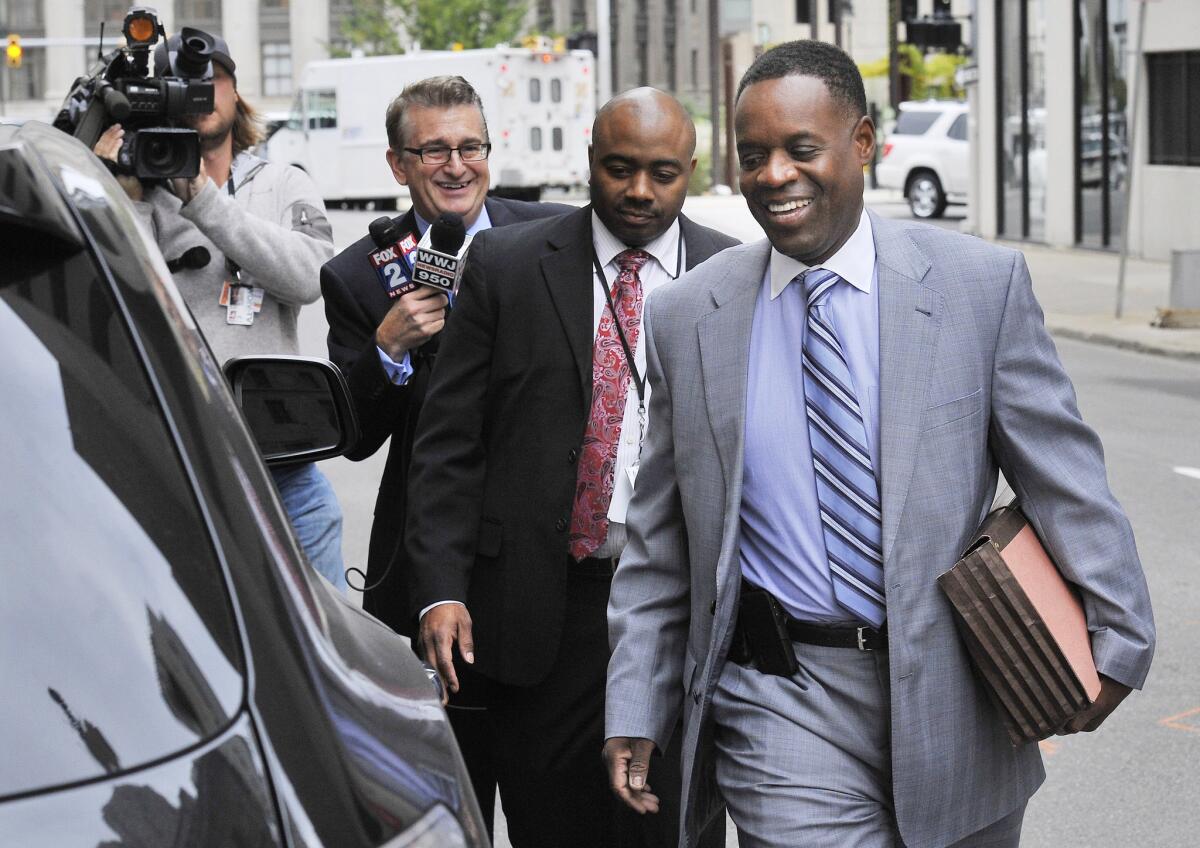 Detroit Emergency Manager Kevyn Orr, right, leaves U.S. District Court in Detroit on Oct. 1.