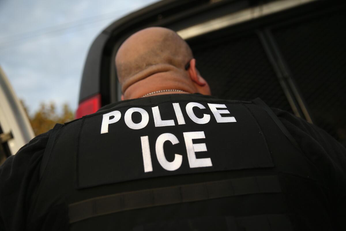 A U.S. Immigration and Customs Enforcement agent takes part in an operation in Los Angeles.