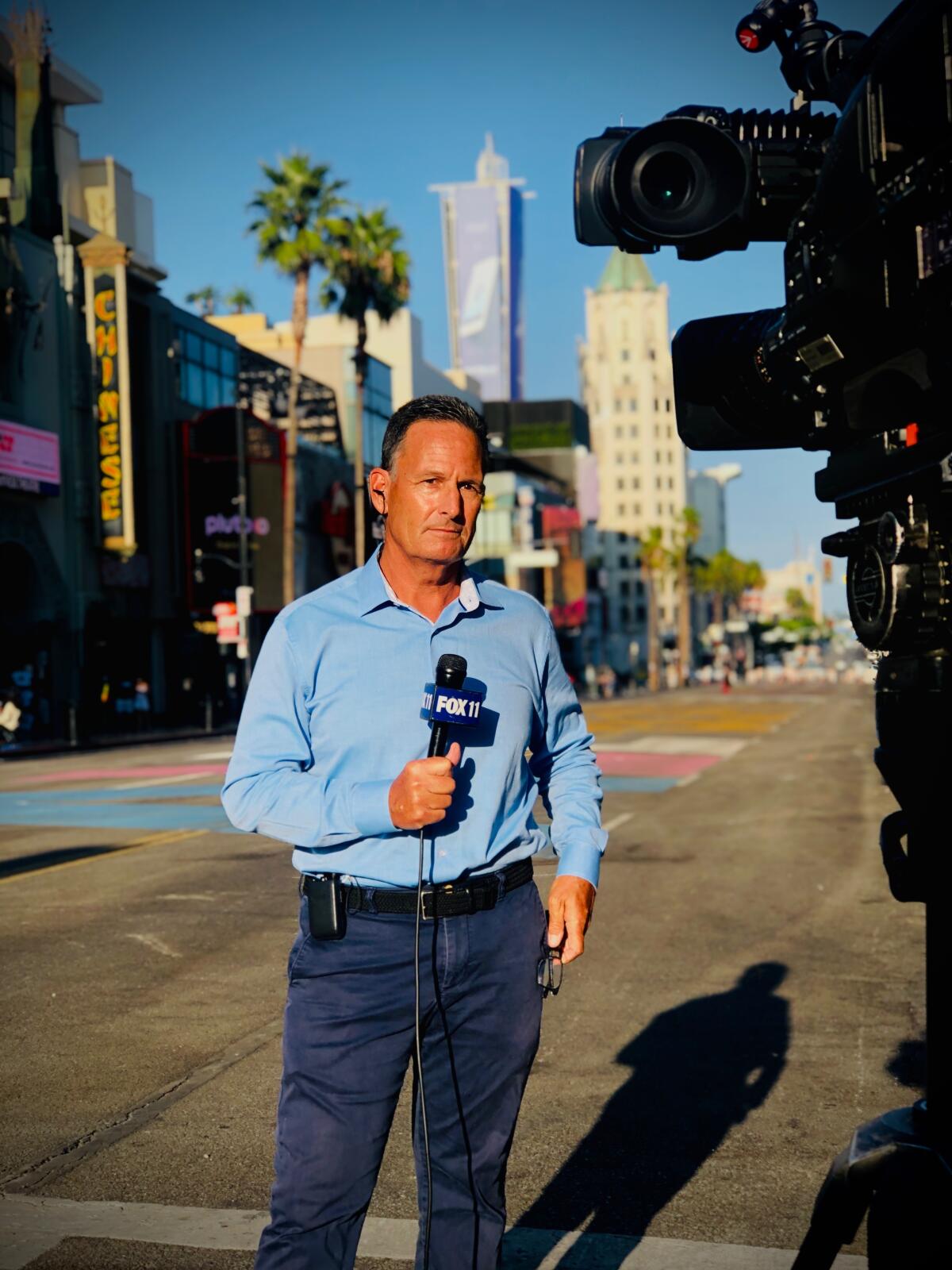 A TV reporter on a Los Angeles street