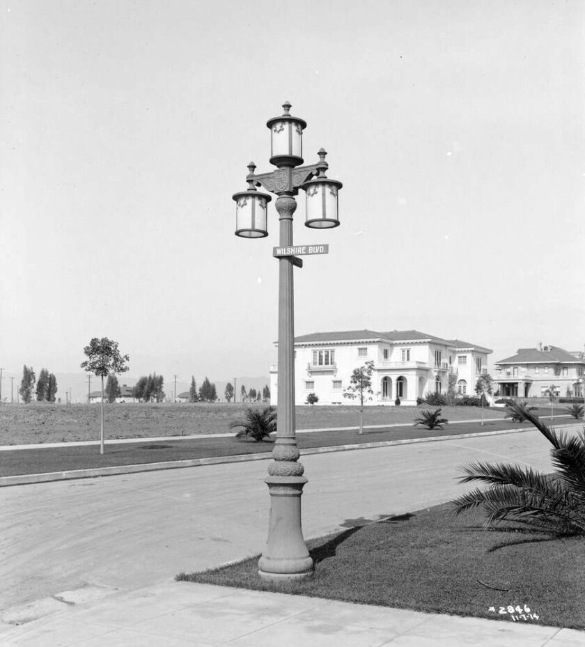 A 1914 view of a three-lamp electrolier on the corner of Wilshire and Windsor boulevards. 