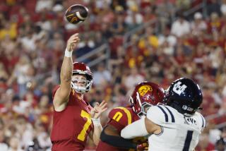 Los Angeles, CA - September 07: USC starting quarterback Miller Moss, #7, left.