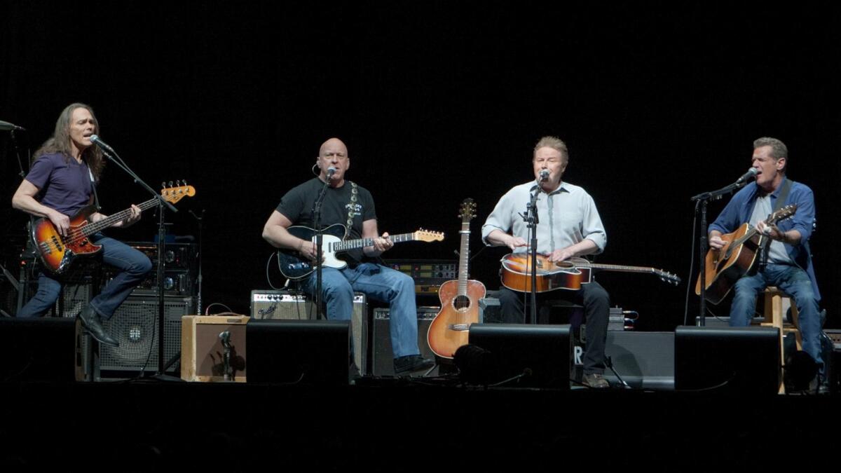 The Eagles, shown during a 2014 performance at the Forum in Inglewood, will be joined by Deacon Frey, son of the band's co-founder, Glenn Frey, for the group's upcoming appearances at the Classic West/East festivals in July.