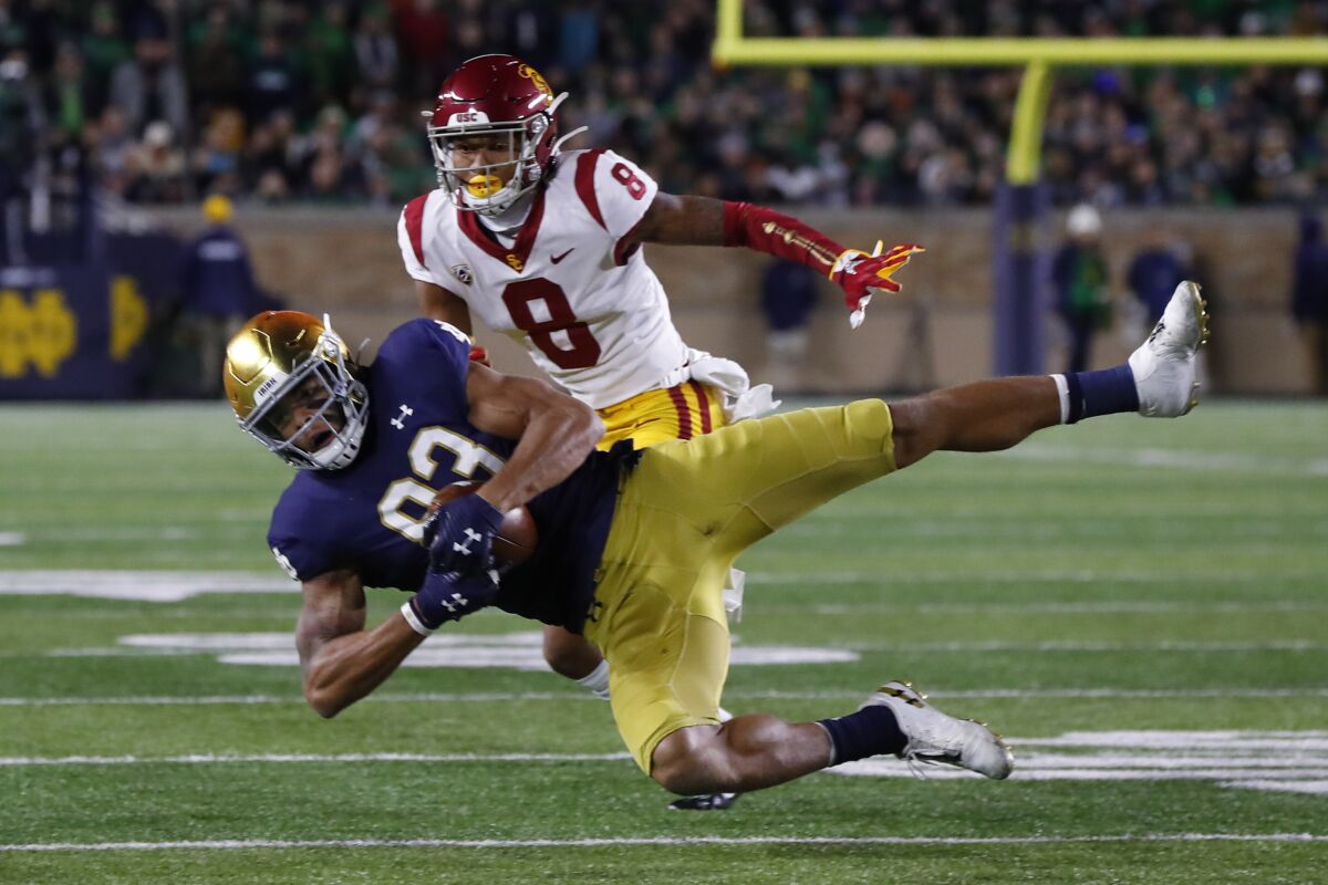 Notre Dame wide receiver Chase Claypool (83) catches a pass as USC cornerback Chris Steele (8) defends in the first half on Saturday in South Bend, Ind.