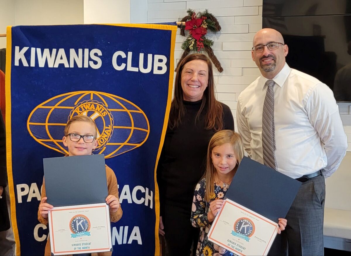 PB Elementary students William Hourigan and Madelyn Hourigan with teacher Pam Denenberg and Kiwanis President Tony Bayona.