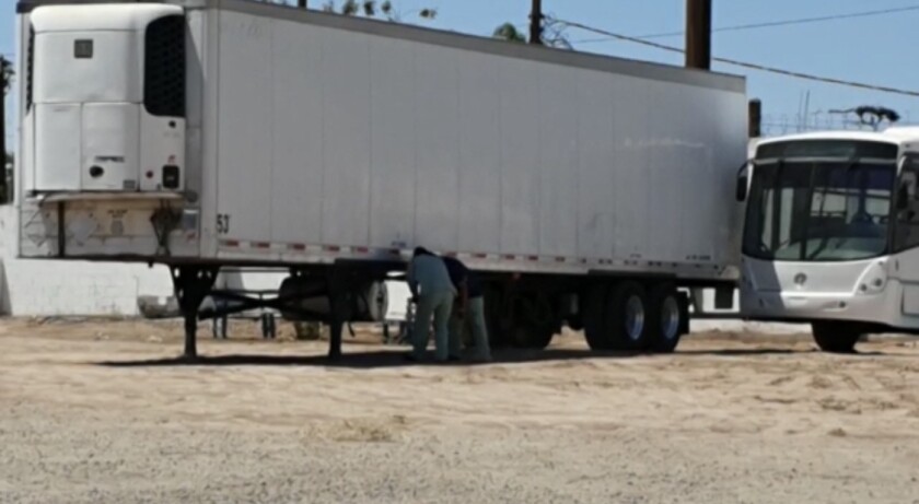 A refrigerated trailer is set up outside Hospital General in Mexicali to store corpses. The hospital is one of the main general hospital's in the state capital designated to treat coronavirus patients.
