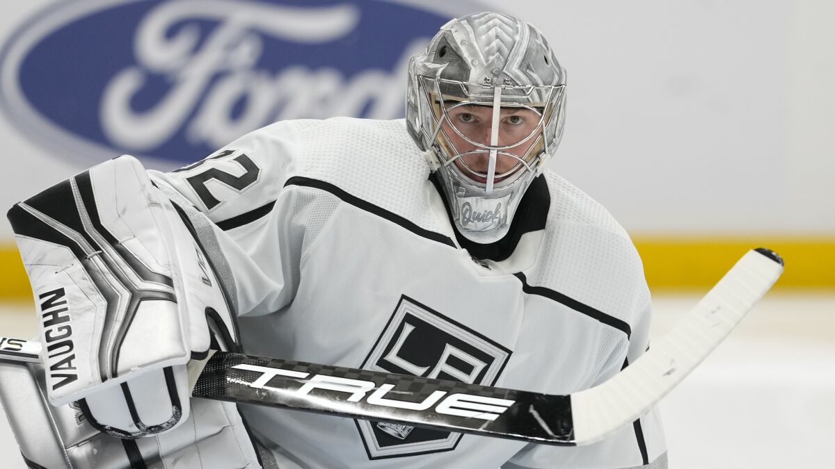 Kings goaltender Jonathan Quick stretches on the ice.