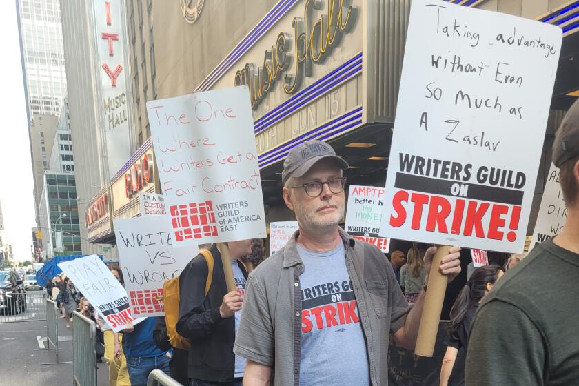 WGA members picket at Radio City Music Hall in New York City during NBCUniversal upfront presentation.