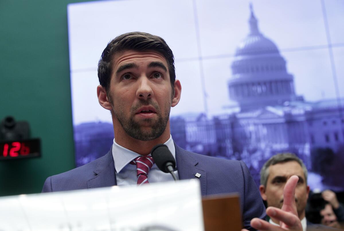 Swimmer Michael Phelps speaks during a congressional hearing Tuesday on Capitol Hill.