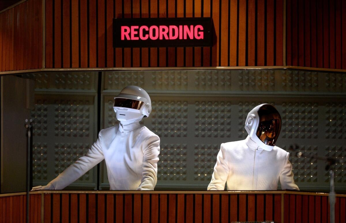 Thomas Bangalter and Guy-Manuel de Homem-Christo of Daft Punk perform during the 56th Grammy Awards.
