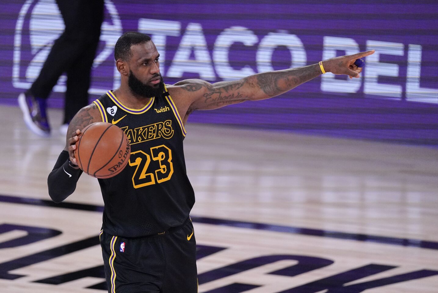 Lakers forward LeBron James directs his teammates during Game 2.