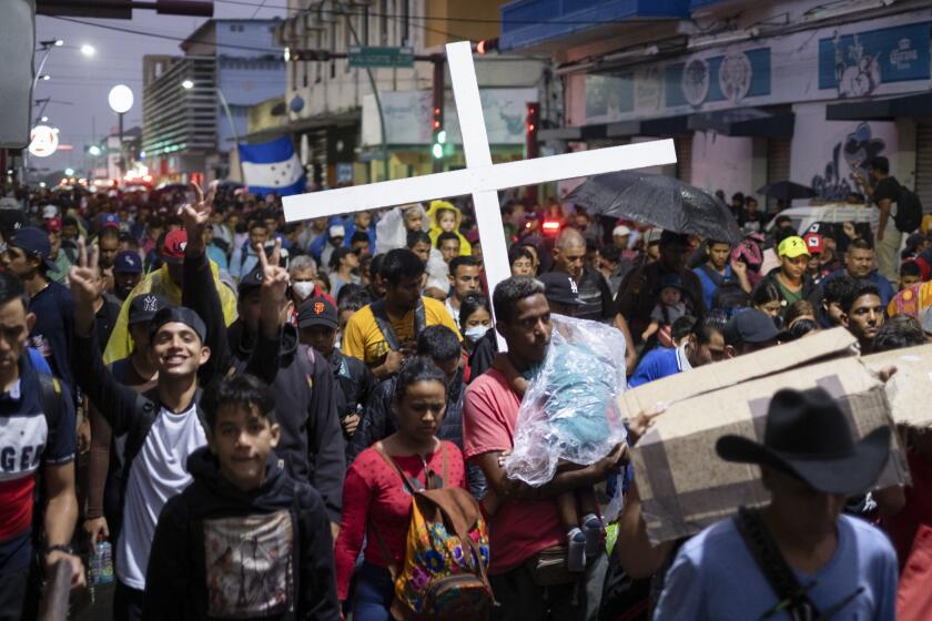 A group of migrants depart by foot the city of Tapachula in Chiapas state, Mexico, early Monday, June 6, 2022. Several thousand migrants set out walking in the rain early Monday in southern Mexico, tired of waiting to normalize their status in a region with little work still far from their ultimate goal of reaching the United States. (AP Photo/Isabel Mateos)