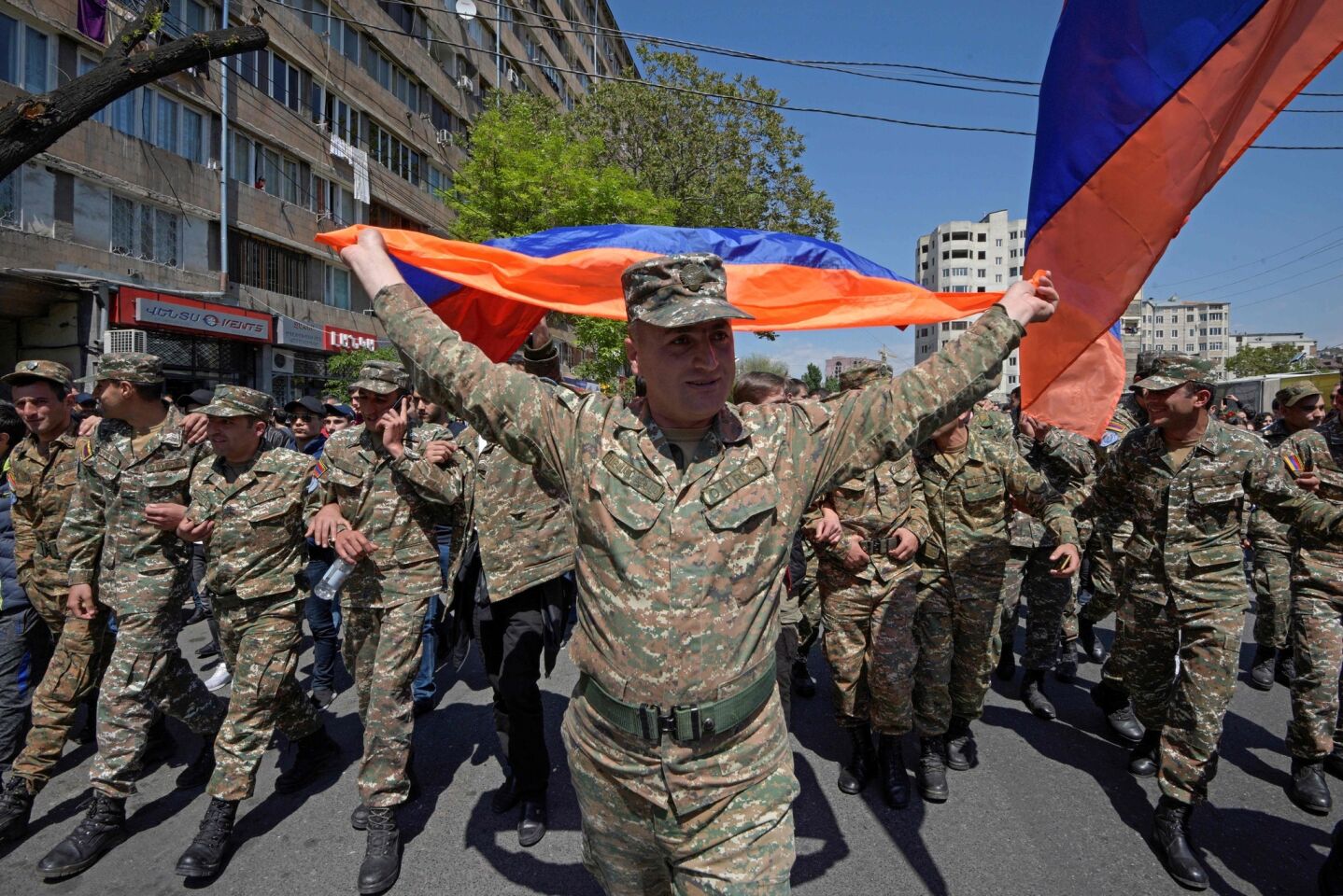Armenian servicemen take part in a demonstration in Yerevan, to protest the former president's election as prime minister.