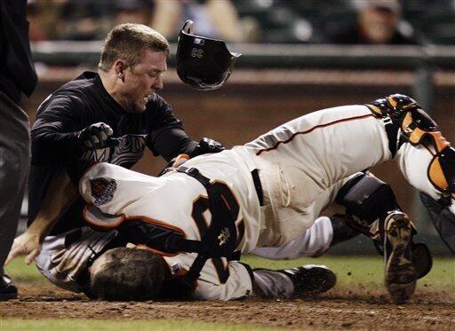 Marlins Anniversary: Scott Cousins runs over Buster Posey for