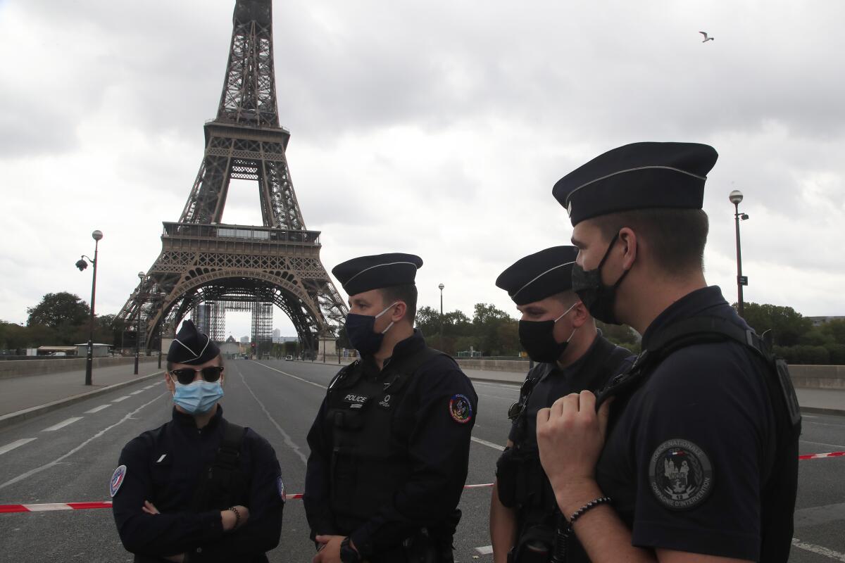 French police officers secure the bridge leading to the Eiffel Tower.