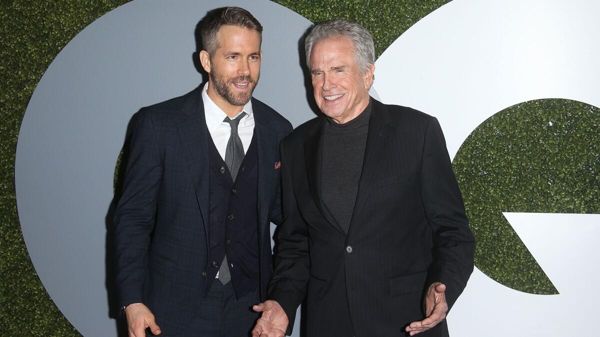Ryan Reynolds, left, and Warren Beatty attend the 2016 GQ Men of the Year Party at Chateau Marmont on Thursday.