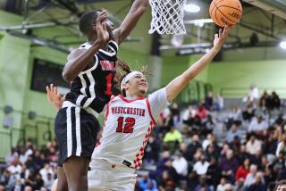 Westchester's Jordan Ballard puts up a shot over Cleveland's Serigne Deme.