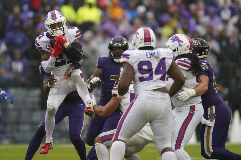Buffalo Bills safety Jordan Poyer (21) intercepts a pass against the Baltimore Ravens in the second half of an NFL football game Sunday, Oct. 2, 2022, in Baltimore. (AP Photo/Julio Cortez)