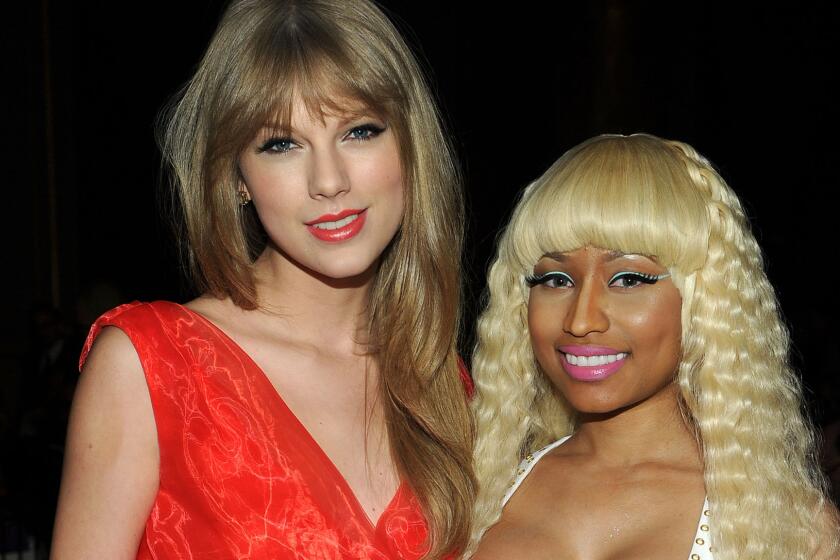 Taylor Swift, left, and Nicki Minaj at an event on Dec. 2, 2011.