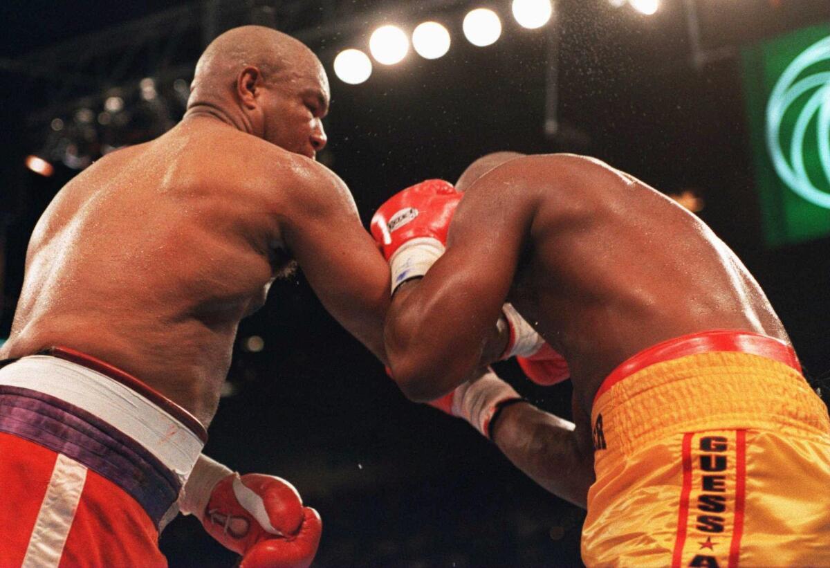 George Foreman follows through on the punch that knocked out Michael Moorer on Nov. 5, 1994.