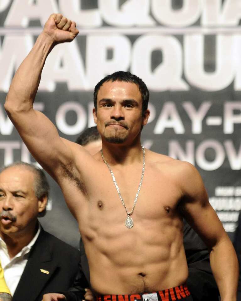 Juan Manuel Marquez acknowledges the crowd after weighing in Friday at the MGM Grand Garden Arena.