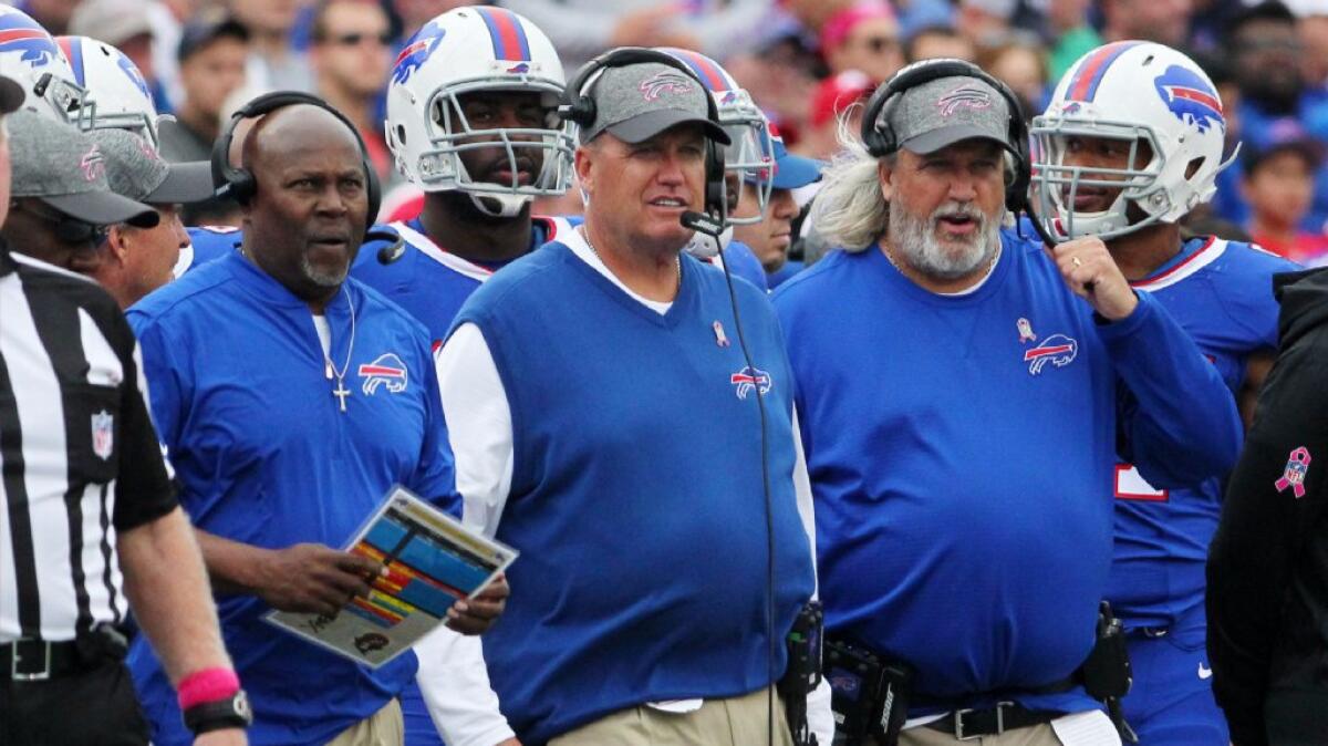 Bills Coach Rex Ryan, center, stands with defensive coordinator Dennis Thurman, left, and assistant coach Rob Ryan, right, during the second half of a game against the 49ers on Oct. 16.