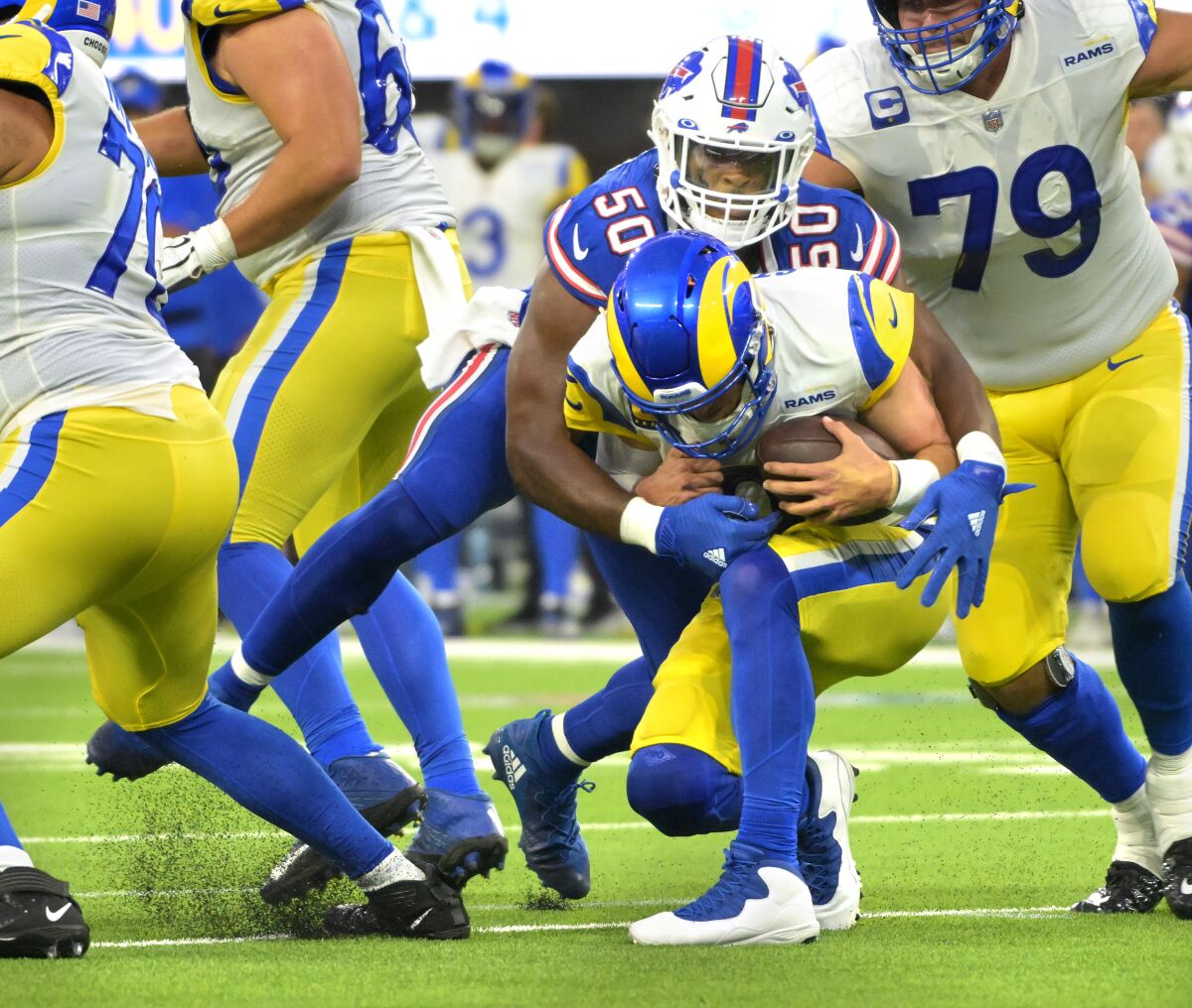 Rams quarterback Matthew Stafford is fired by Bill's defensive end Gregory Rousseau in the third quarter.