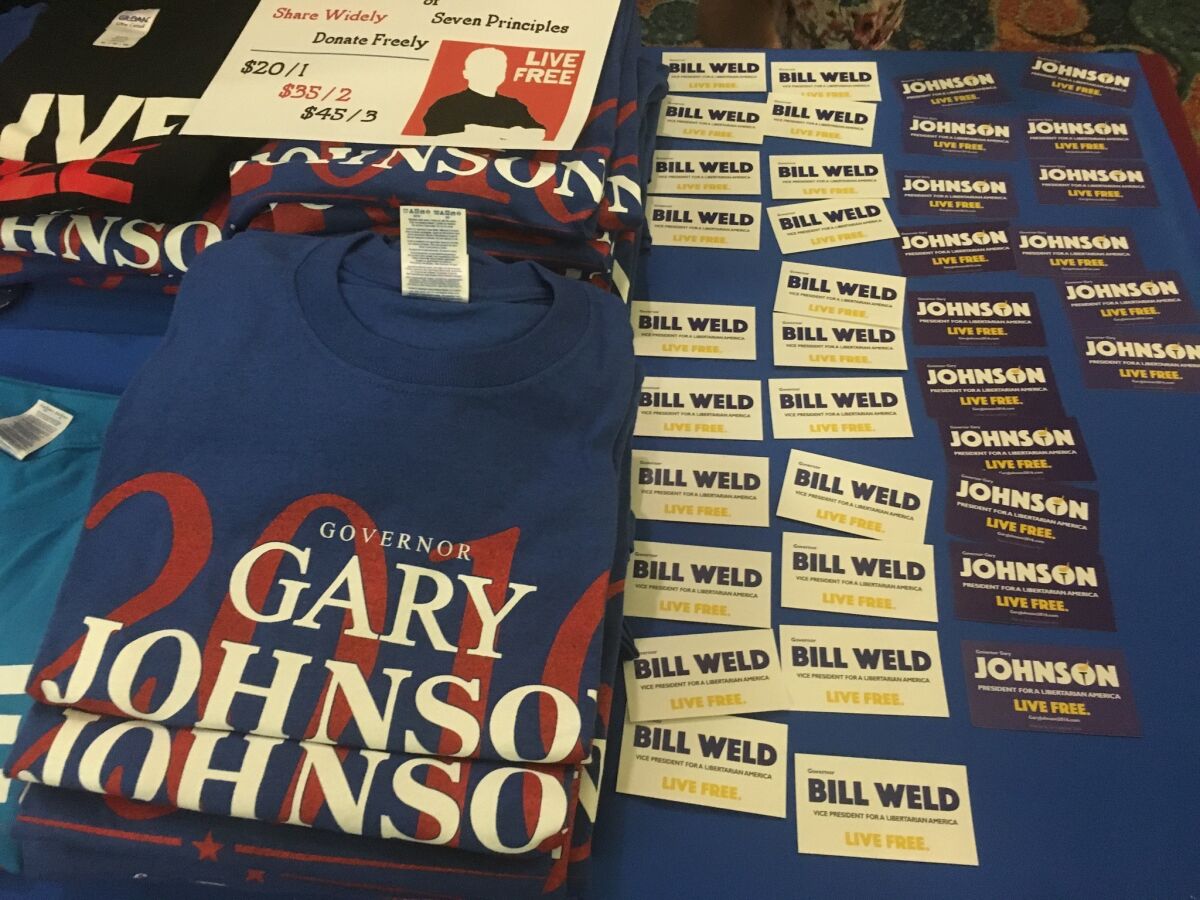 Merchandise on display for former New Mexico Gov. Gary Johnson and former Massachusetts Gov. Bill Weld, who are running for the presidential and vice-presidential nomination, respectively, at the Libertarian Party Convention in Orlando, Fla.