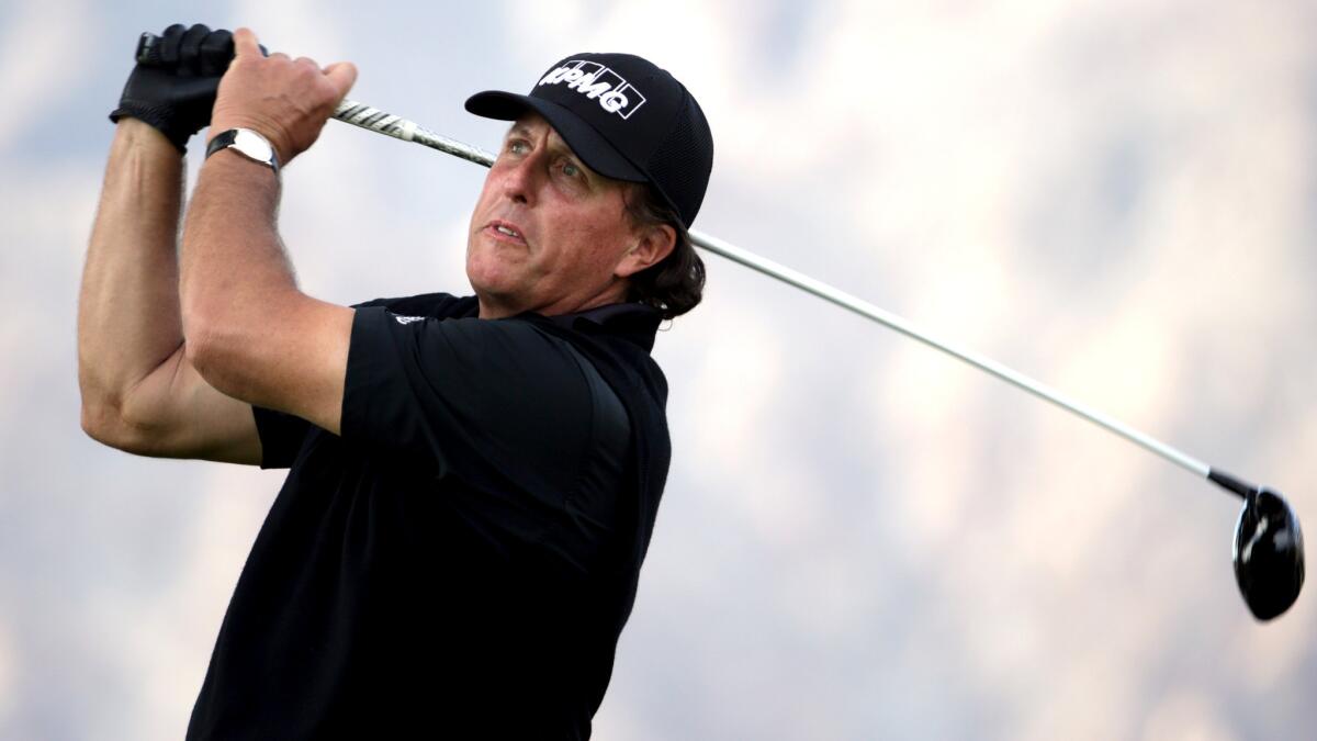 Phil Mickelson watches his tee shot at No. 12 at La Quinta Country Club on Thursday during the first round of the CareerBuilder Challenge.