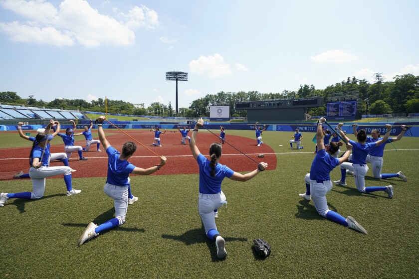 Players on Italy's softball team warm up during a training session at Fukushima Azuma Baseball Stadium.