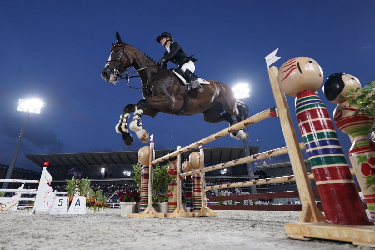 Germany's Julia Krajewski, riding Amande de B'Neville, competes during the Equestrian Eventing Jumping competition during the 2020 Summer Olympics, Monday, Aug. 2, 2021, in Tokyo, Japan. (AP Photo/Carolyn Kaster)