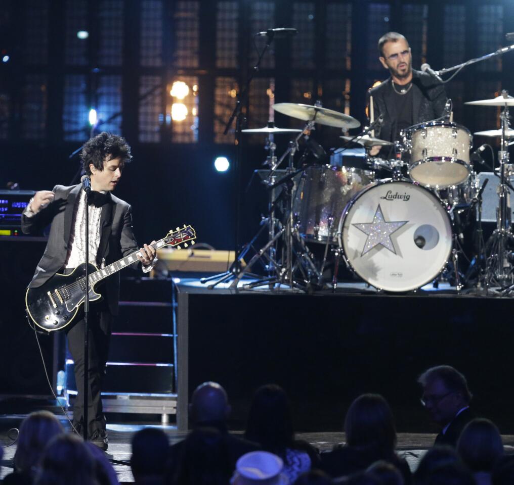 Billie Joe Armstrong of Green Day, left, and Ringo Starr perform at the Rock and Roll Hall of Fame induction ceremony in Cleveland.